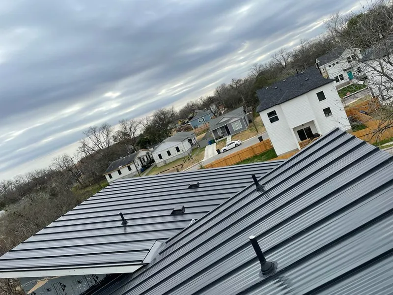 Standing seam metal roof panels with vents for Skylight Repair in Zachary